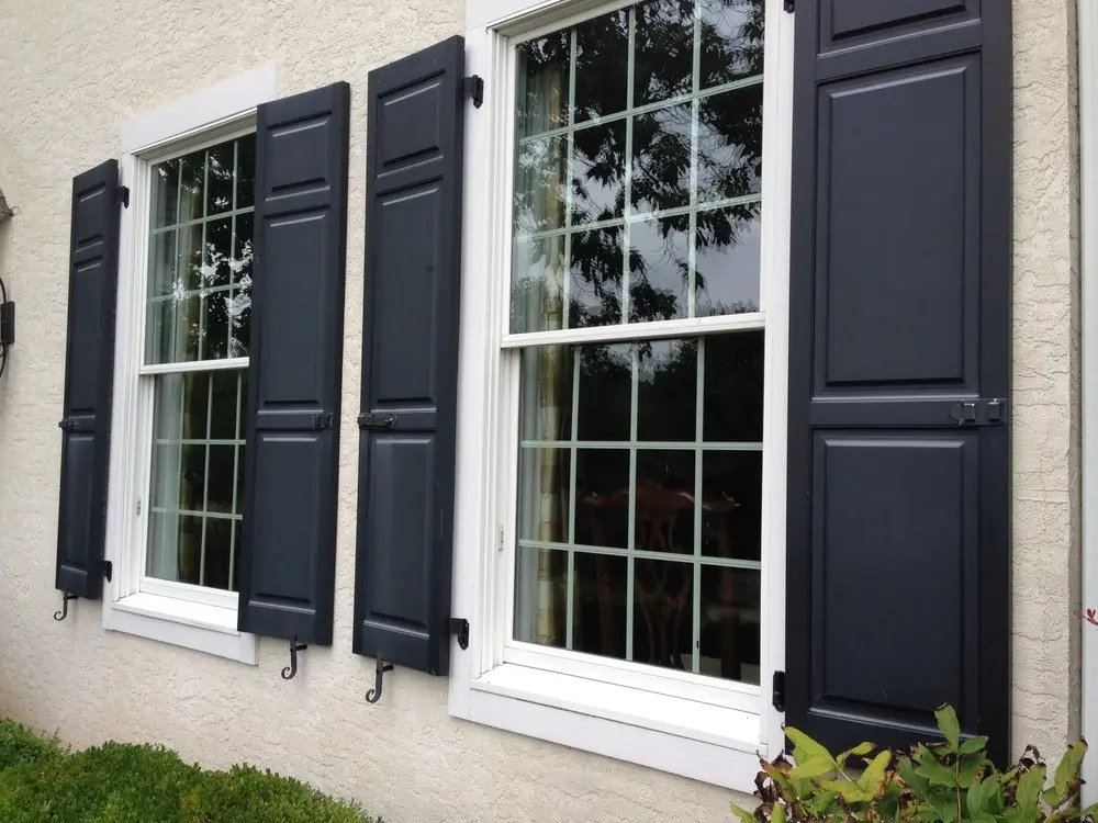 Crisp repainted exterior shutters framing windows