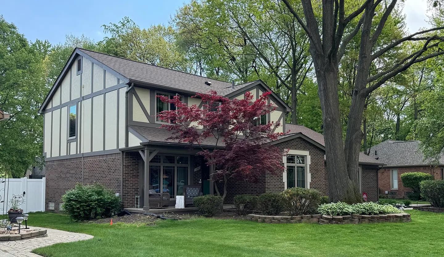 Exterior painting project at 13863 Woodsett Court, Shelby Township — Crisp Khaki Benjamin Moore