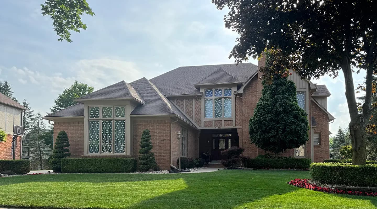 Exterior painting project at 54262 Meadowood Court, Shelby Township — Dormer Brown - Sherwin Williams