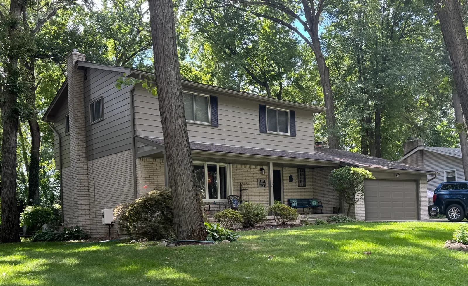 Exterior painting project at 6070 Thorneycroft Dr, Shelby Township — Roosevelt Taupe - Benjamin Moore