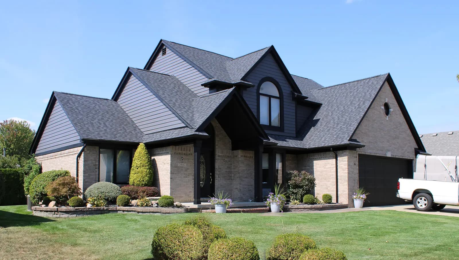 Exterior painting project at 54661 Cabrillo Drive, Macomb — Tricorn Black - Sherwin Williams