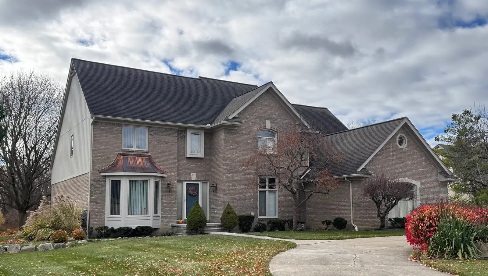 Exterior painting project at 437 Oakbridge Drive, Rochester — Anew Gray - Sherwin Williams