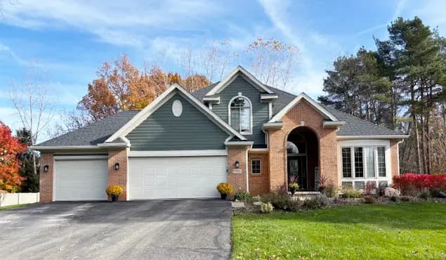 Exterior painting project at 6966 Woodlyn Court, Clarkston — Pewter Green - Sherwin Williams