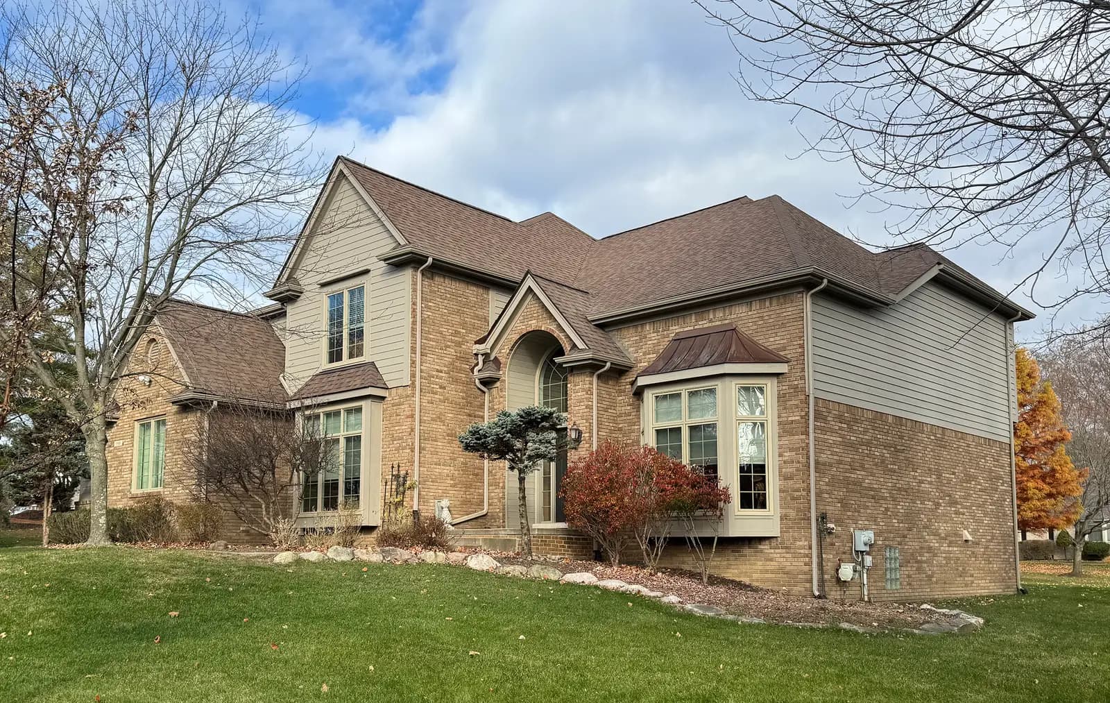 Exterior painting project at 1946 Blue Grass Drive, Rochester Hills — Waynesboro Taupe - Benjamin Moore