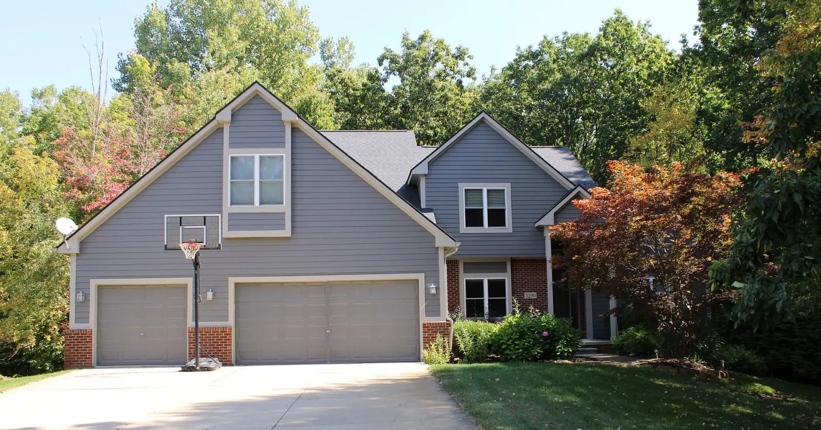 Exterior painting project at 3290 Stoneridge Court, Commerce Township — Kendall Charcoal - Benjamin Moore