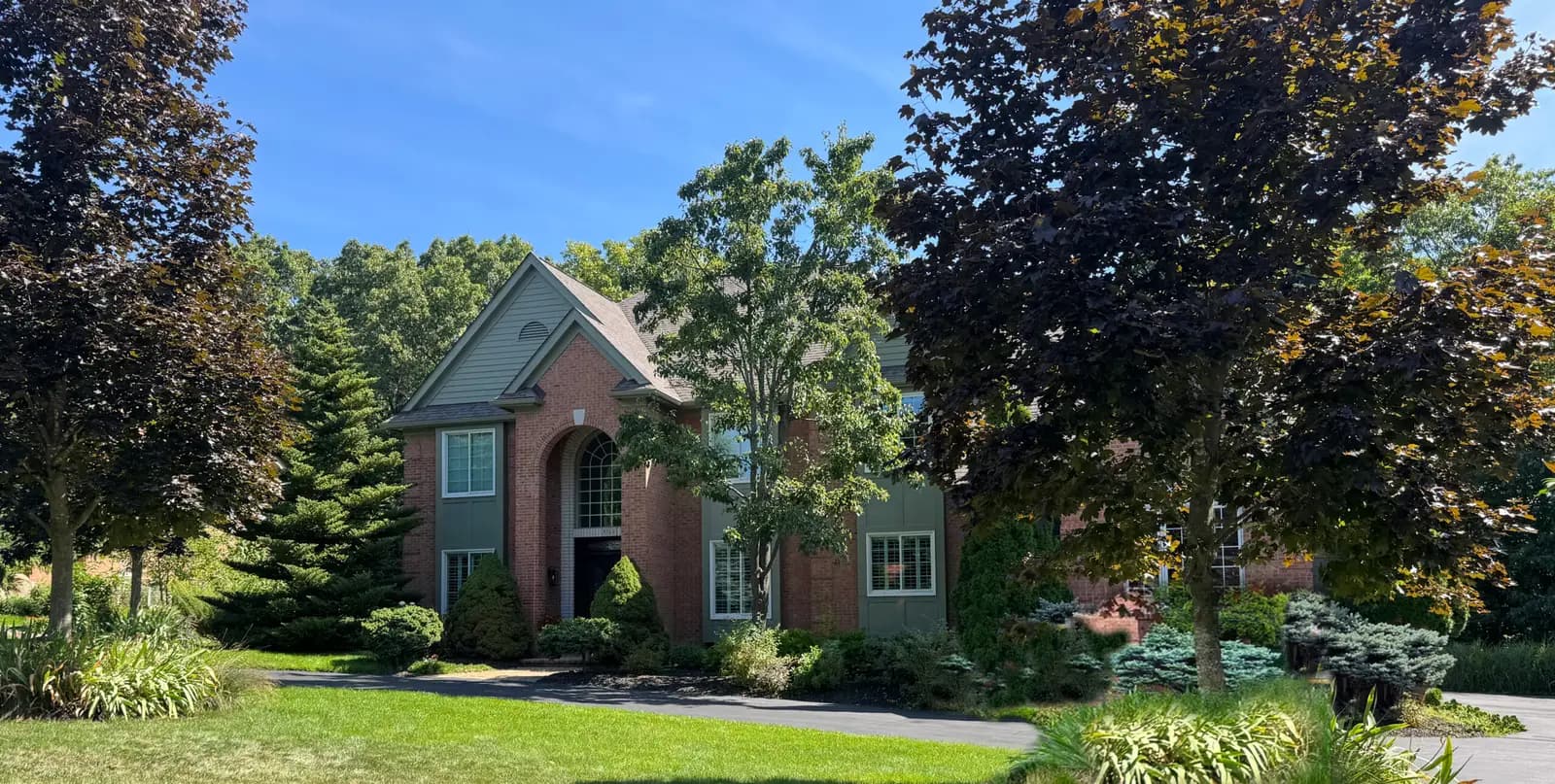 Exterior painting project at 8744 Deerwood Road, Clarkston — Rolling Hills - Benjamin Moore